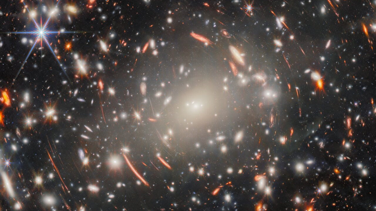 Nasa reveals stunning views of distant galaxies through Webb and Hubble telescopes