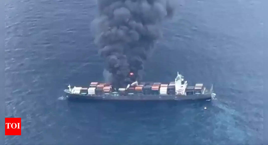 Watch: Fire breaks out on Singapore-flagged ship; 18 crew abandon burning container, rescued by Navy and Coast Guard, say defence sources | Kochi News