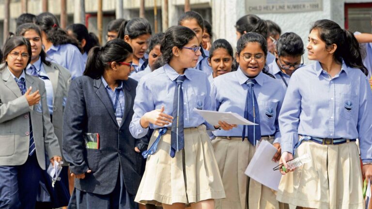 Students come out of their exam centre after appearing for the Class 12th English CBSE examination, in Noida,