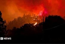 Fast-moving Canada wildfire doubles in size forcing thousands to flee homes