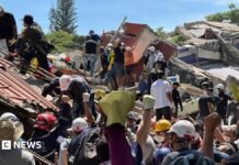Anguish of Colombian brother at rubble of building being searched for earthquake survivors