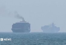 Hormuz talks positive, Oman says, as Iran warns deal would not open strait